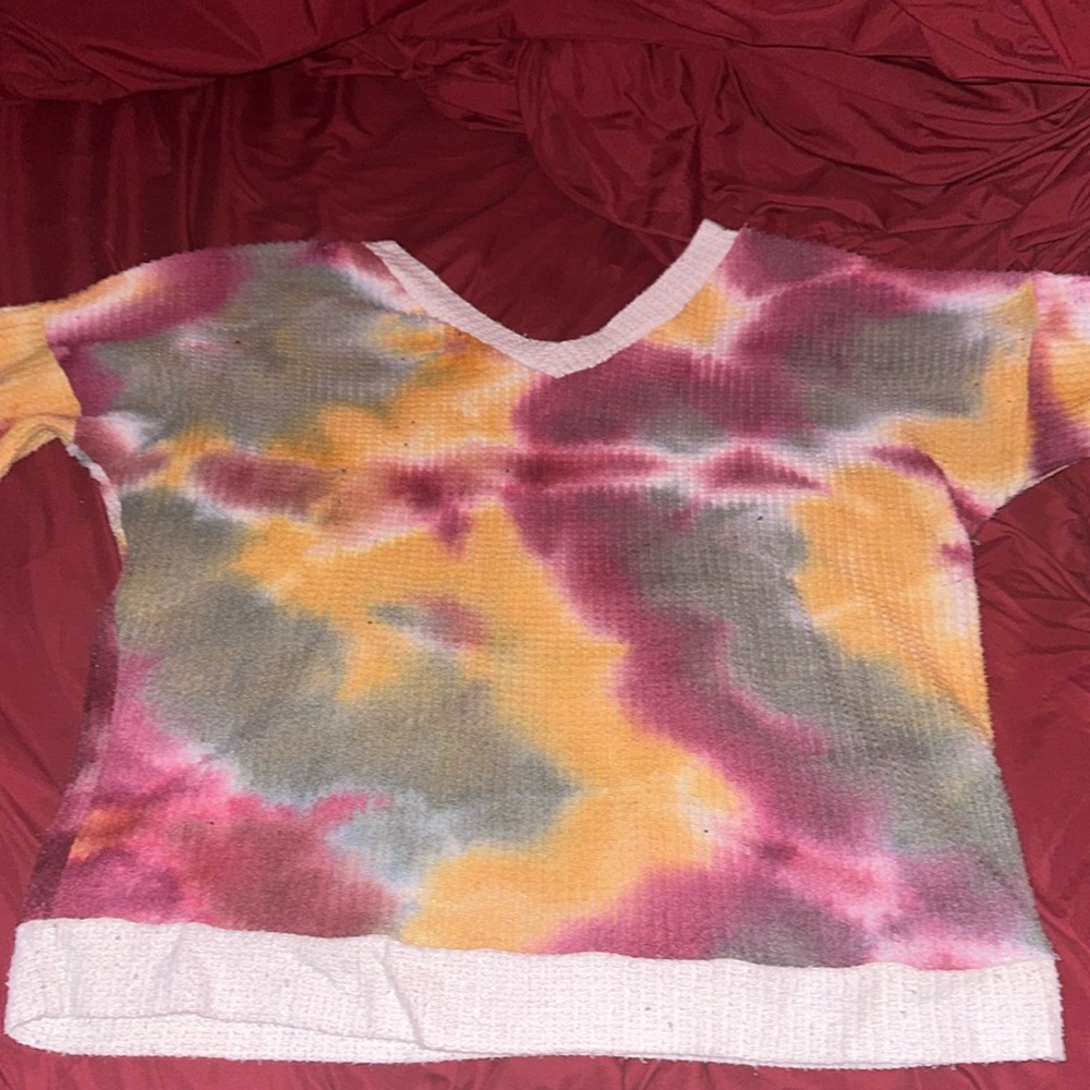 Multi color V neck sweater brand is OP I believe and size is Medium